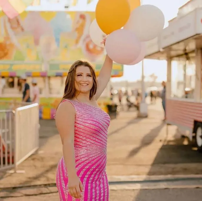 A girl wearing a pink dress